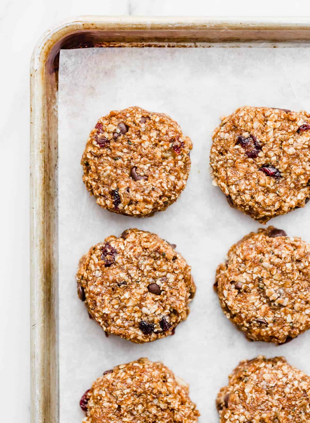 Healthy Breakfast Cookies on a parchment lined baking sheet.