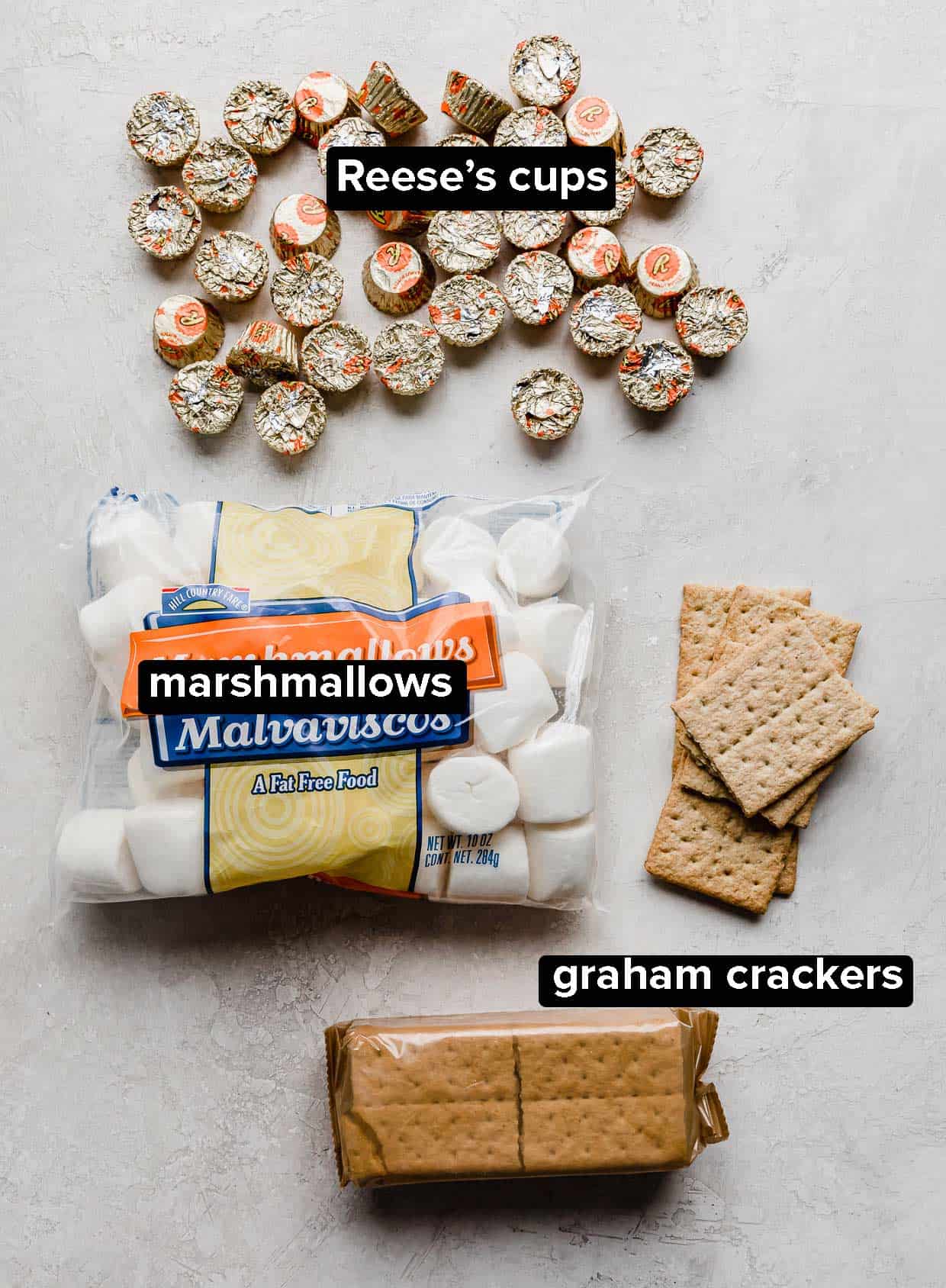 Ingredients used to make Reese's S'mores on a white background.