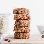 A stack of healthy breakfast cookies on top of each other, against a white background.