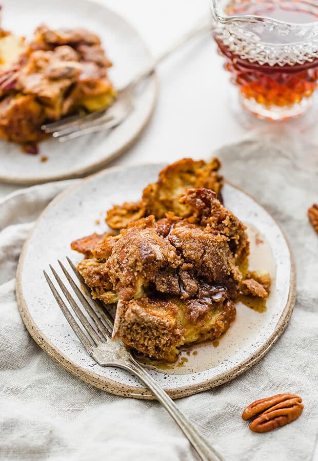 Overnight Pumpkin French Toast Casserole on a plate with a fork nearby.