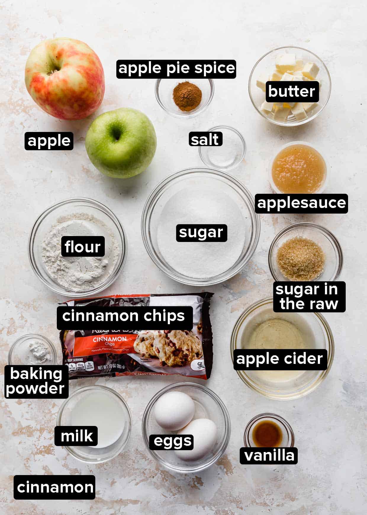Ingredients used to make apple cinnamon scones on a white background.