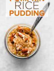 Pumpkin rice pudding topped with chopped pecans.