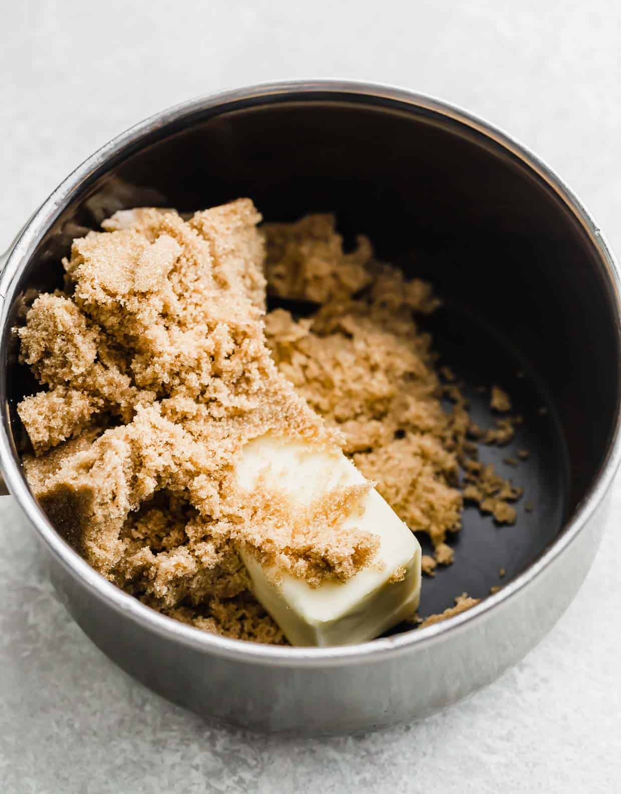 a pot with butter and brown sugar in it, for making Homemade Caramel Apple Dip.