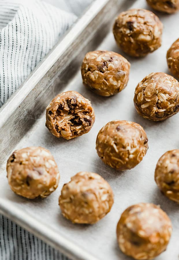 A bite taken out of a Chocolate Peanut Butter Protein Ball.