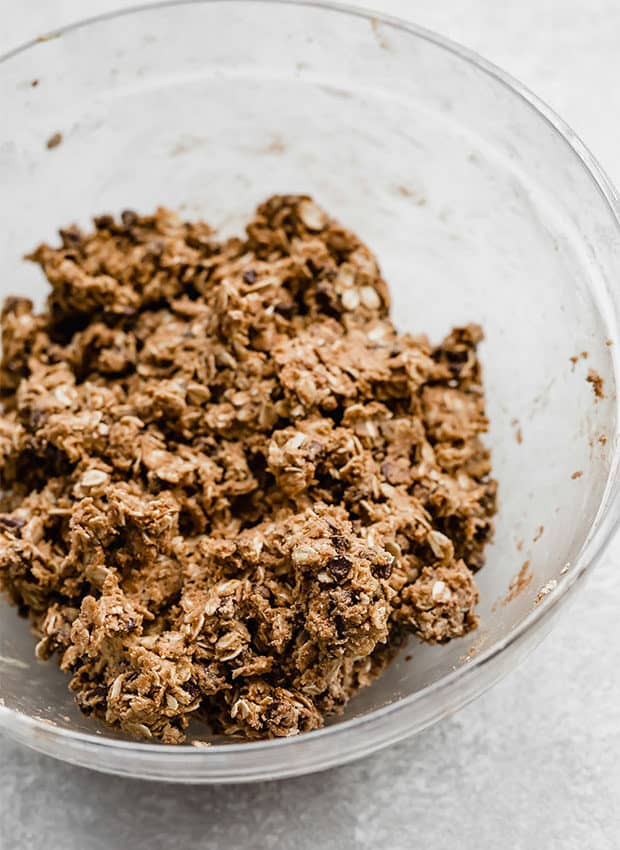 Chocolate Peanut Butter Protein Balls ingredients mixed in a large glass bowl.