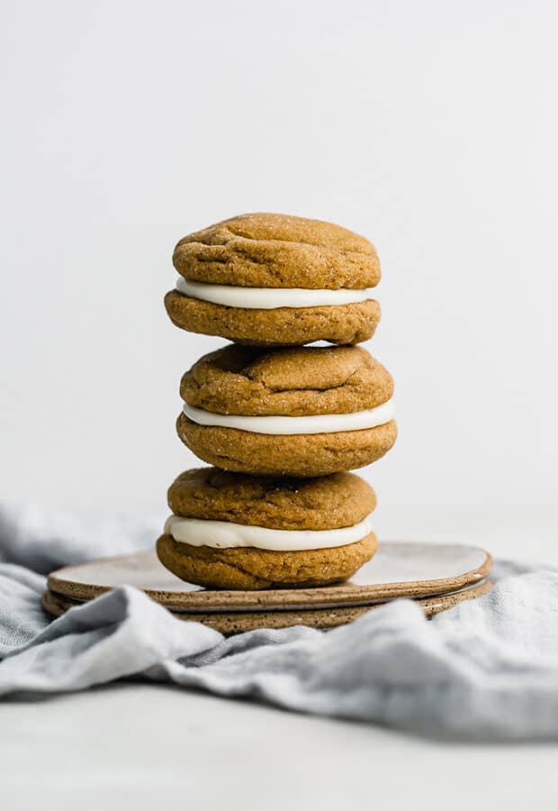 A stack of 3 gingerbread whoopie pies.