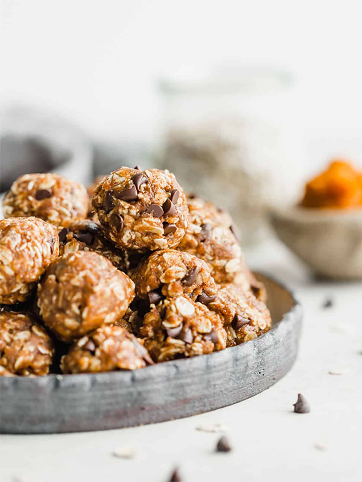 Pumpkin Energy Balls on a black plate.