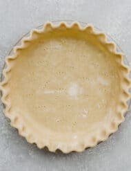 An all butter Food Processor Pie Crust on a gray background.