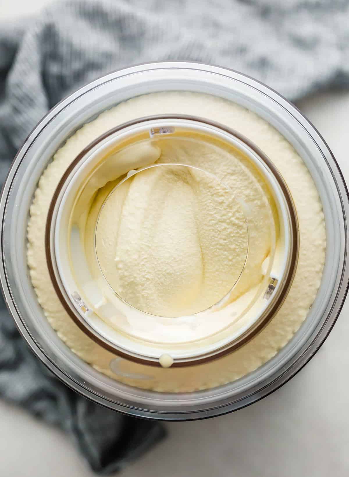 An ice cream maker churning Homemade Vanilla Ice Cream.