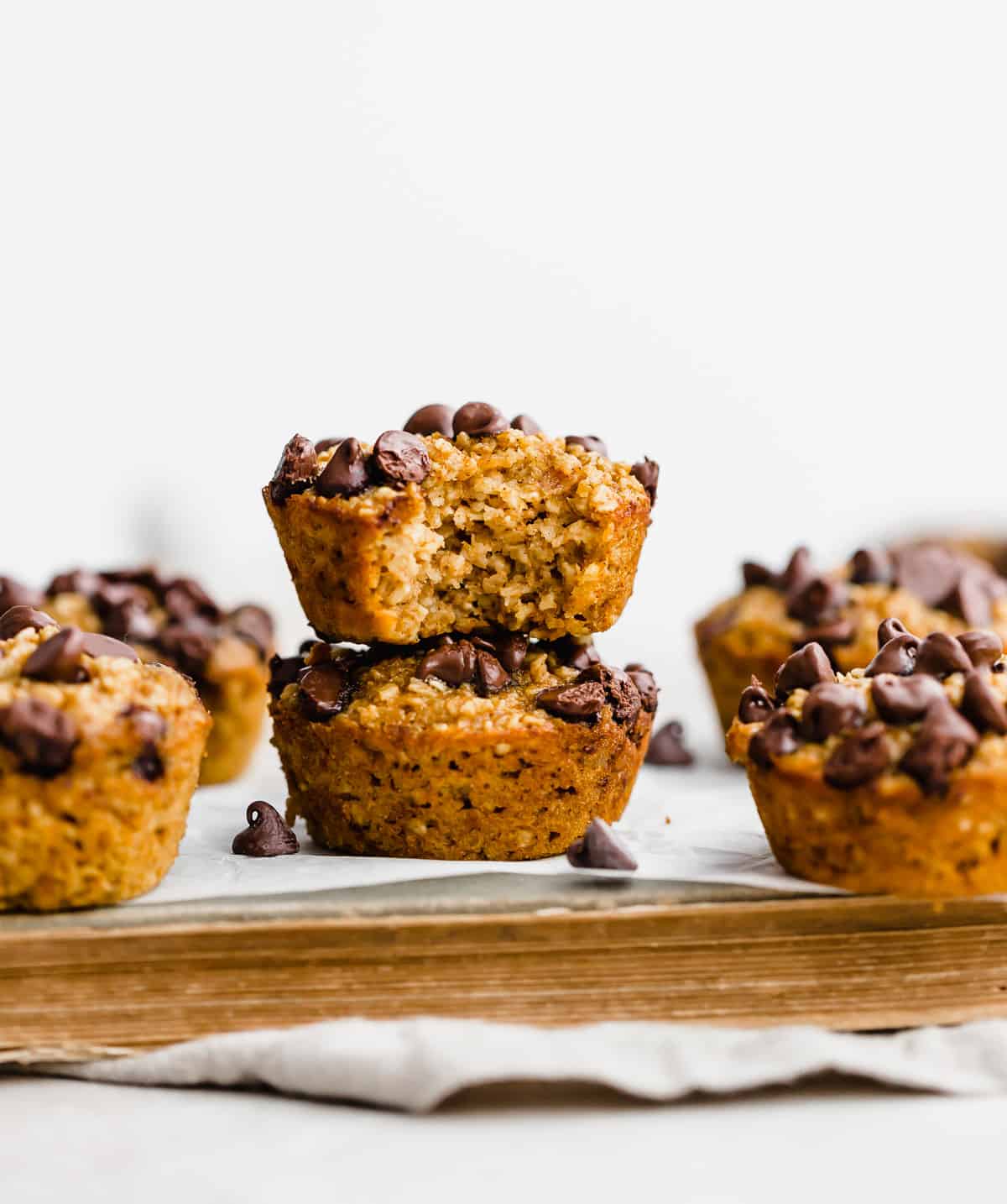 Chocolate Pumpkin Baked Oatmeal Cups  against a white background.