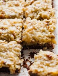 German Chocolate Brownies on a white background cut into squares.