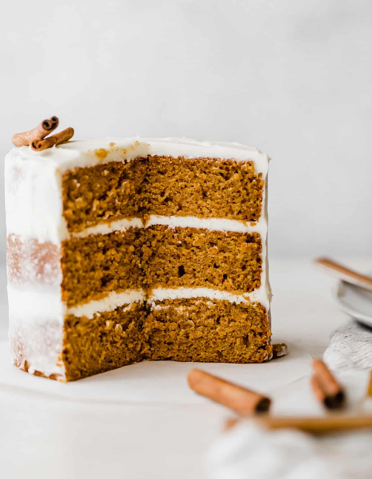 A pumpkin layer cake on a white background.