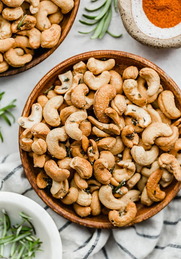 Rosemary roasted cashews on a plate.