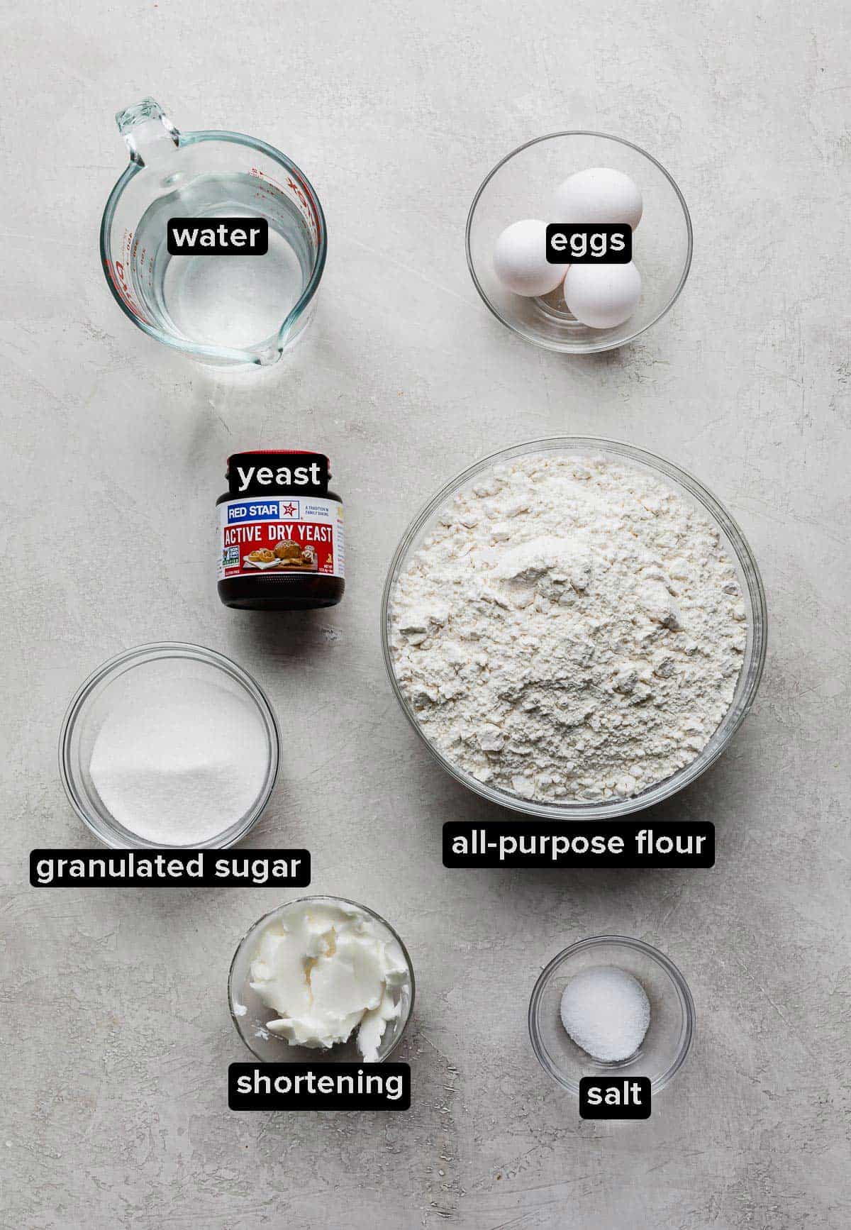 Ingredients used to make the best homemade dinner rolls on a light gray background.