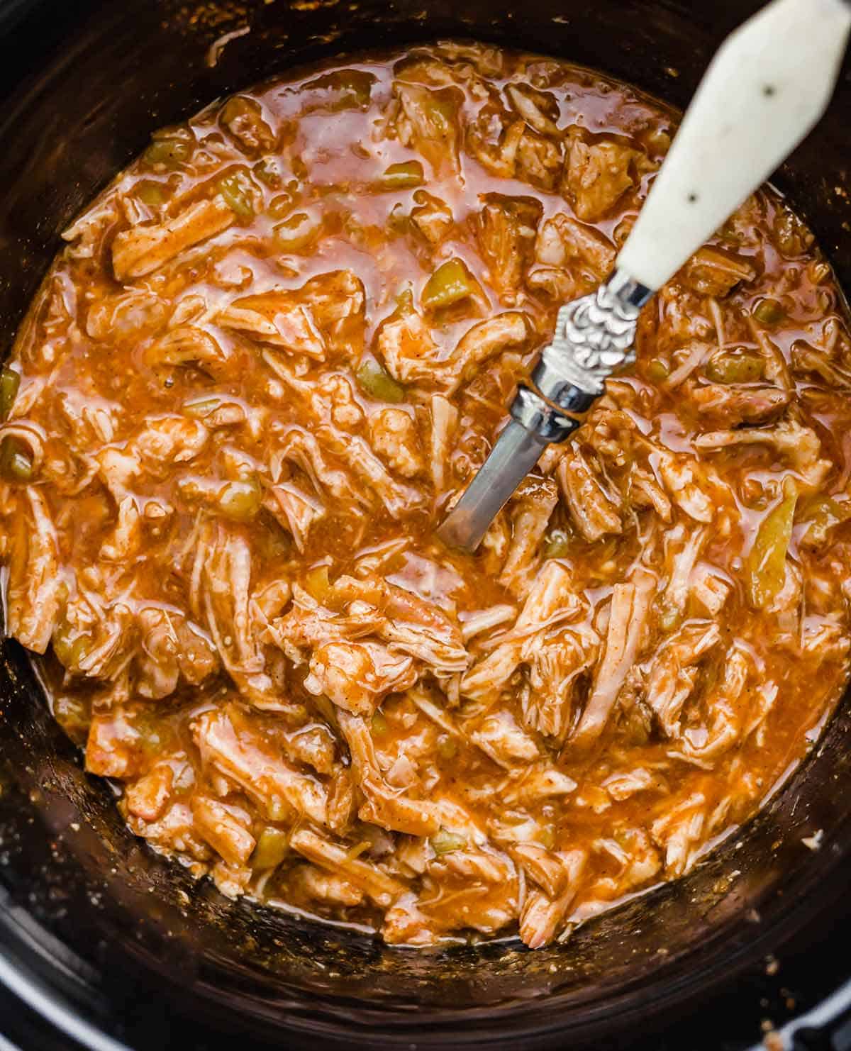 Cafe Rio Sweet Pork Recipe in a black slow cooker.