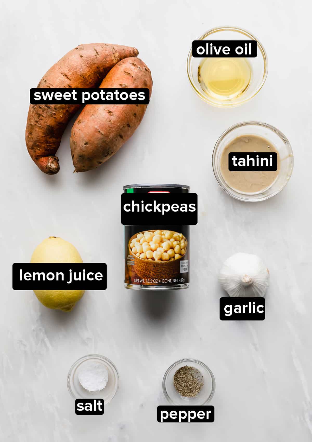 Sweet Potato Hummus ingredients on a marble background.