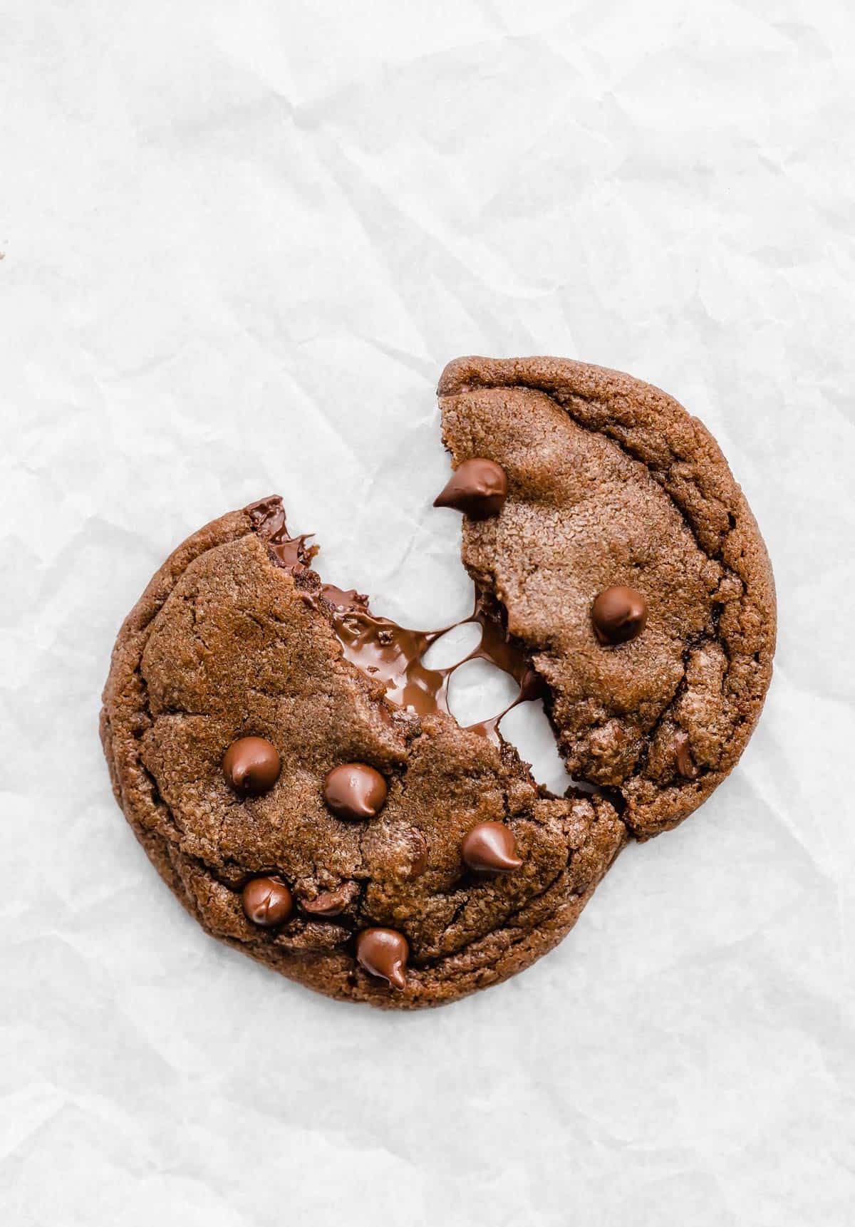 A Nutella Stuffed Nutella Cookies on a white parchment paper.
