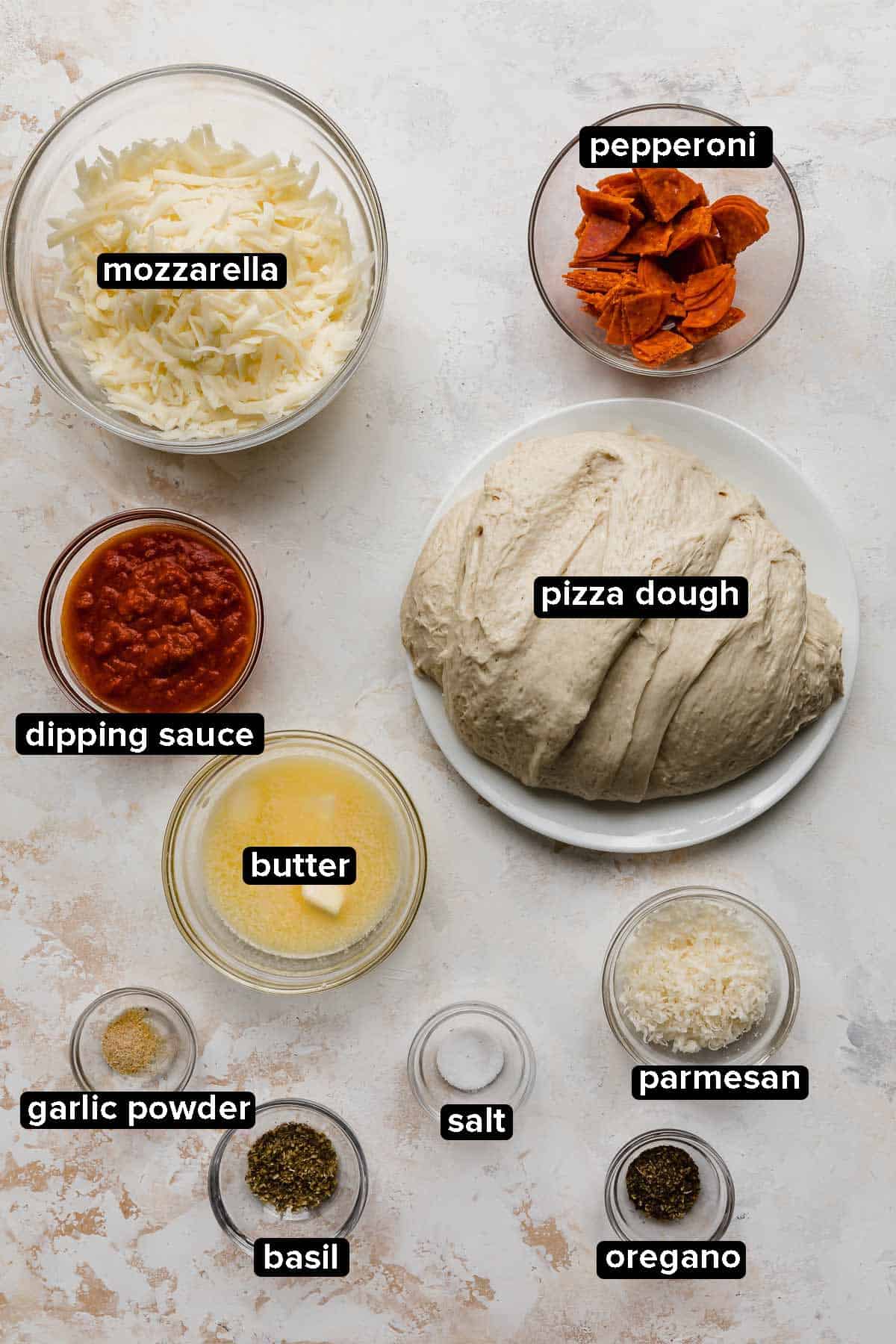 Pizza Rolls ingredients on a white textured background. 