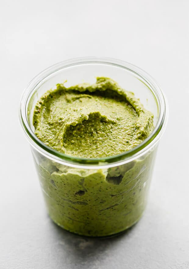 A jar of green sauce.