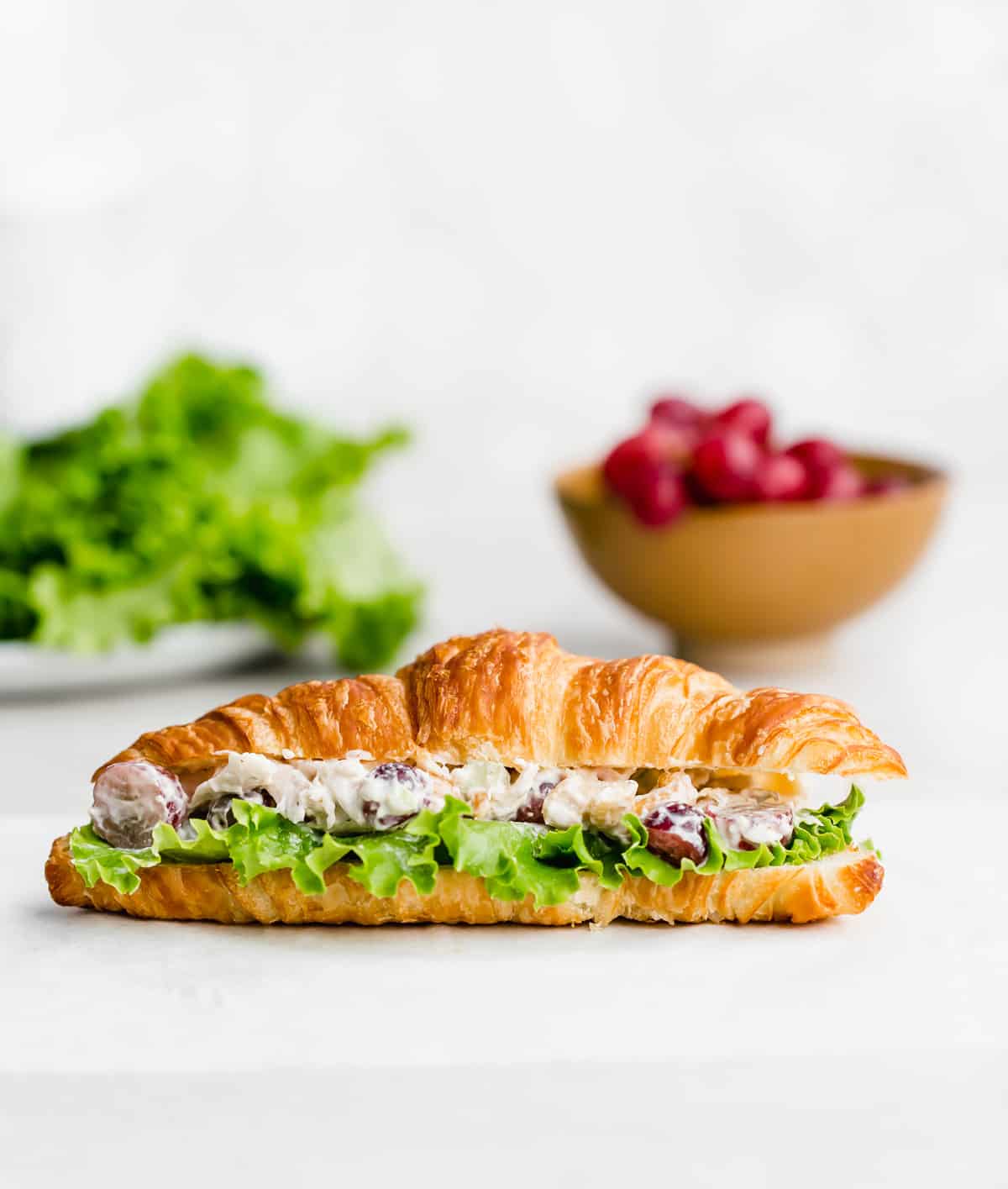 A Chicken Salad Sandwich Recipe on a croissant.