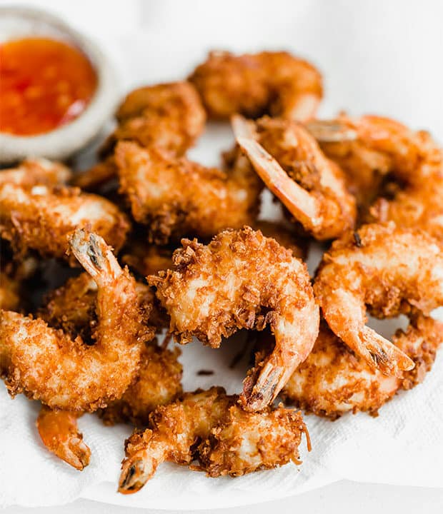 A pile of golden and crisp coconut shrimp.