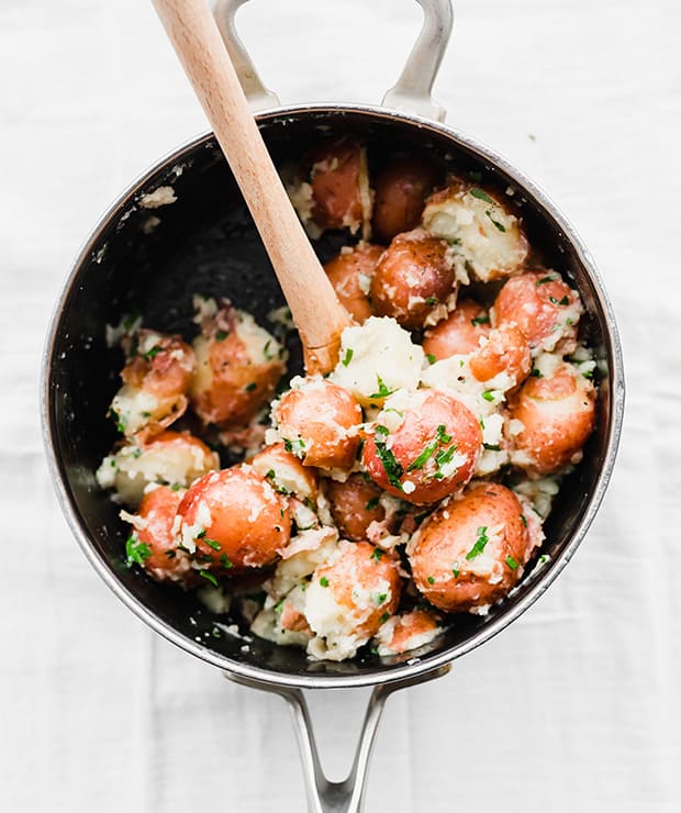 A pot full of Buttery Parsley Potatoes.