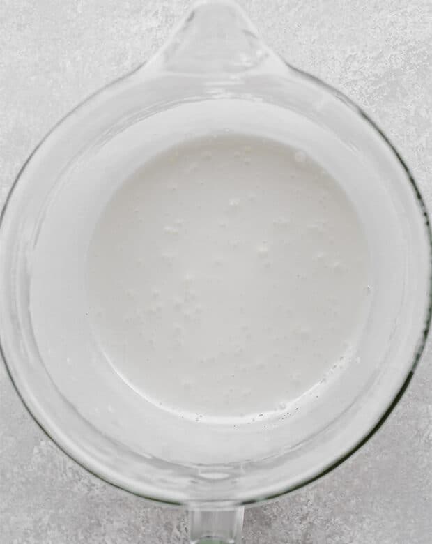 A glass bowl with cooked sugar and egg whites (prior to whipping the meringue).