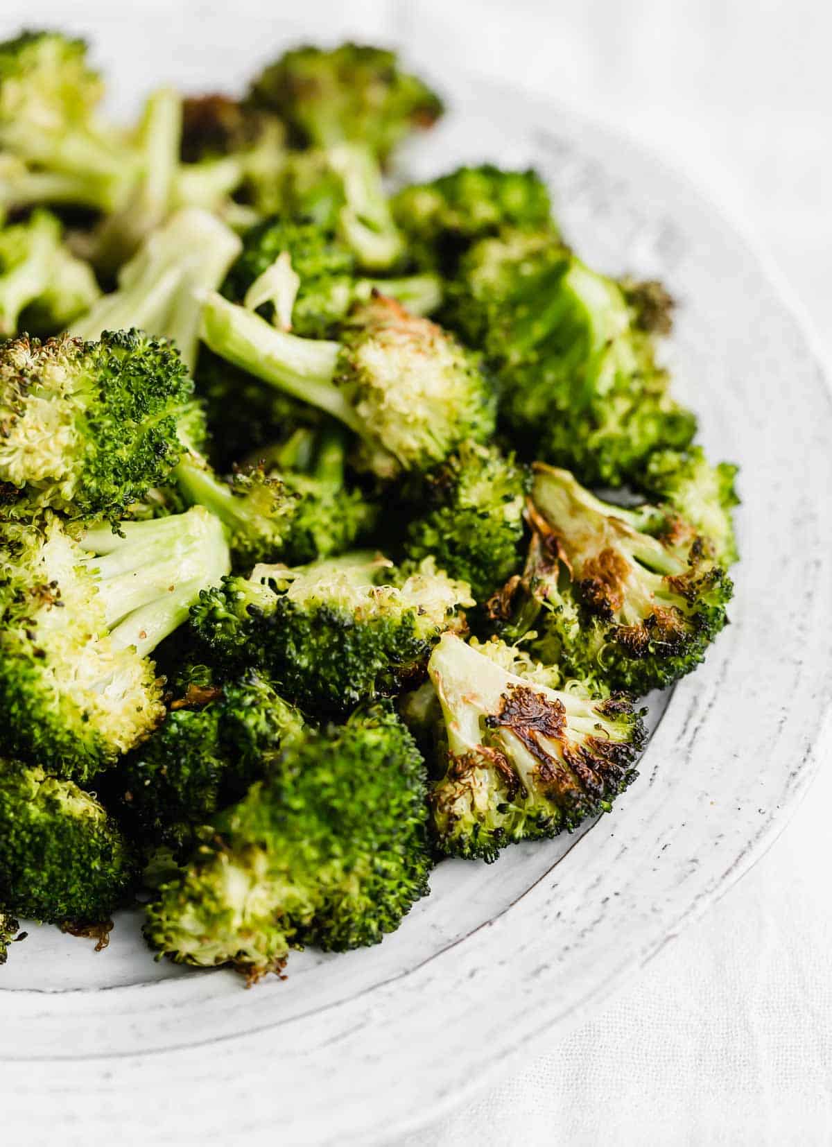 Easy Oven Roasted Broccoli on a white plate.