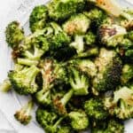 Oven Roasted Broccoli on a white plate.