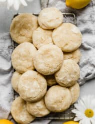 A small stack of lemon cookies on a white background.