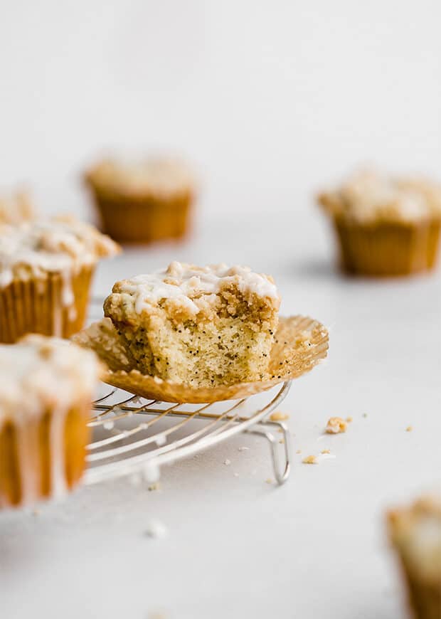A Lemon Poppy Seed Muffin on a cooling rack.