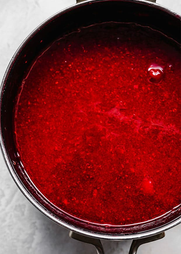 A saucepan full of raspberry freezer jam, in the making.