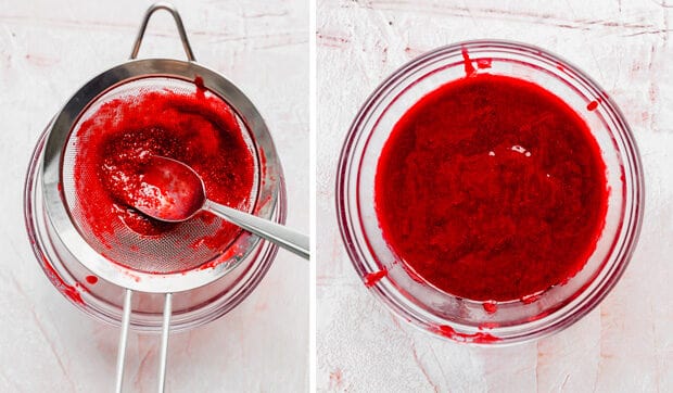 A fine mesh strainer over a glass bowl, removing raspberry seeds from a raspberry sauce.