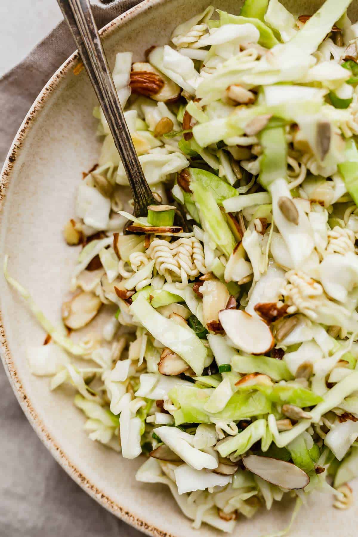 Close up photo of Crunchy Cabbage Salad with almonds and ramen.