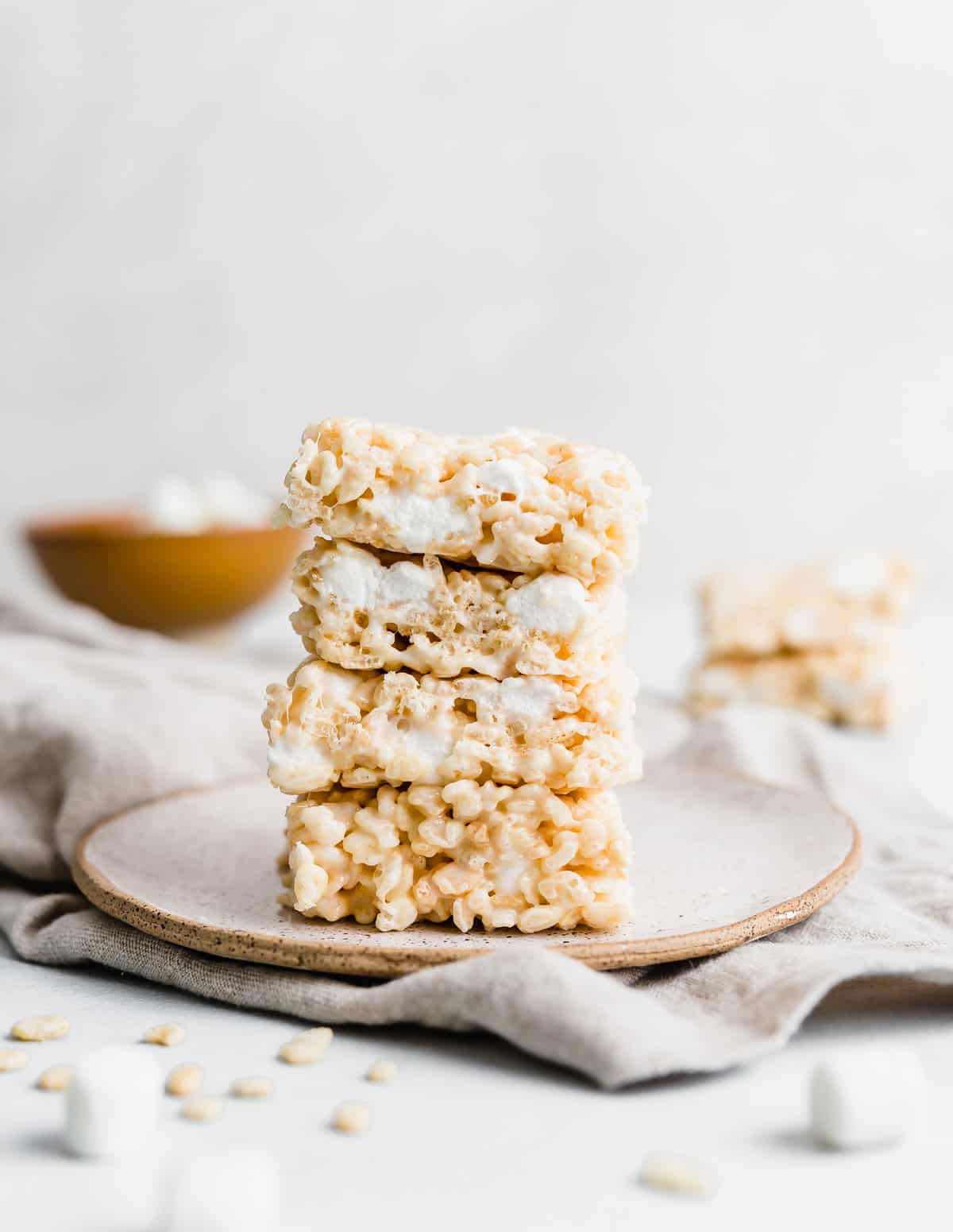 A stack of Rice Krispies Treats against a white background.