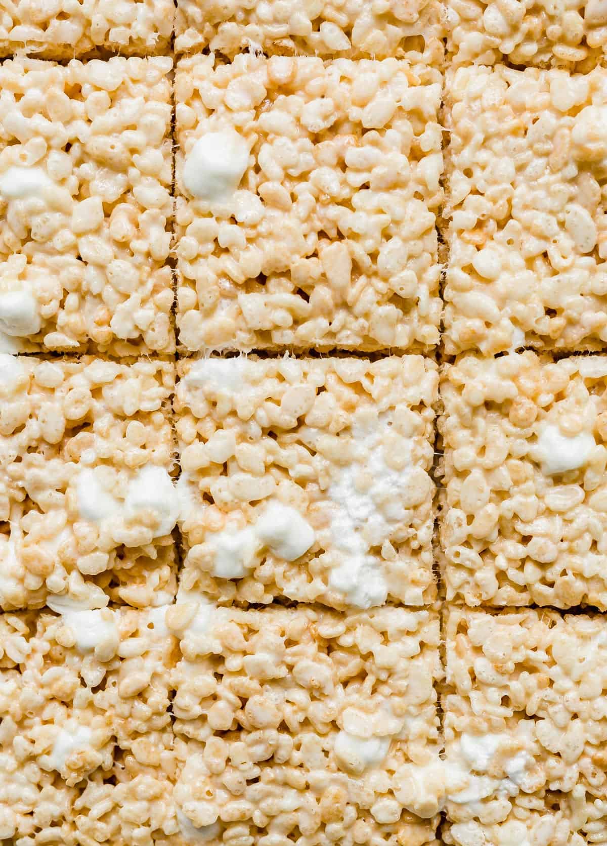 Close up photo of Rice Krispies Treats cut into squares.