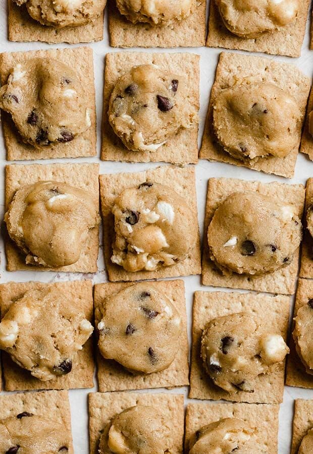 Graham cracker squares topped with a disk of marshmallow stuffed cookie dough.