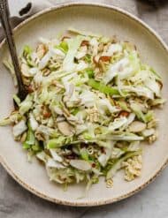 Crunchy Cabbage Salad on a tan plate.
