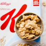 A bowl of Special K Cereal Candy sitting on top of a box of Special K Cereal.