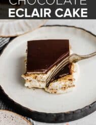 A slice of Chocolate Eclair Cake on a plate with the words, "Chocolate Eclair Cake' in white text over the photo.