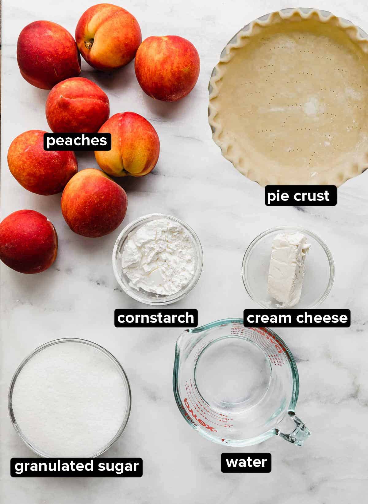 Fresh Peach Pie ingredients on a white background.