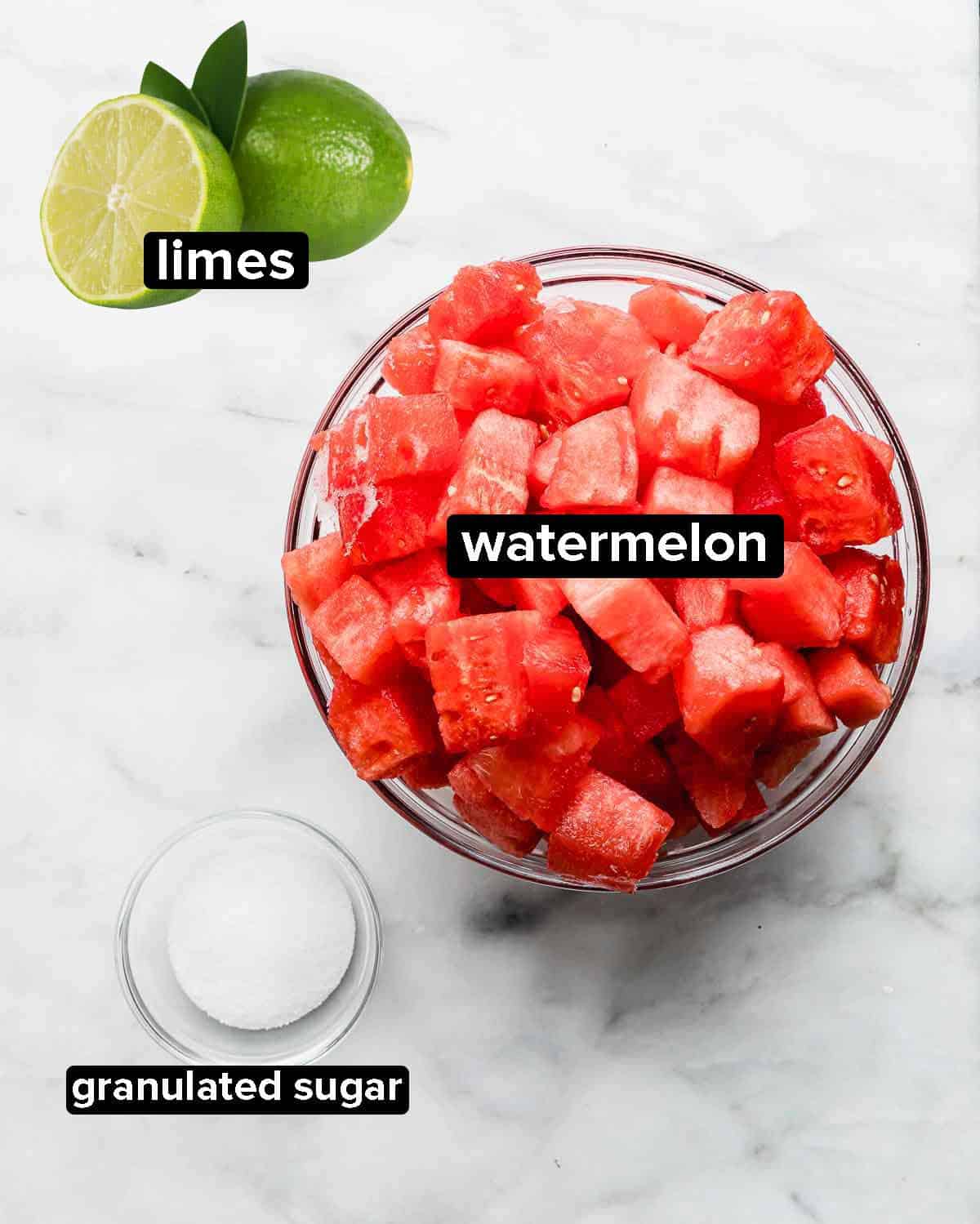 Watermelon Juice ingredients on a white background: watermelon, sugar, and limes.