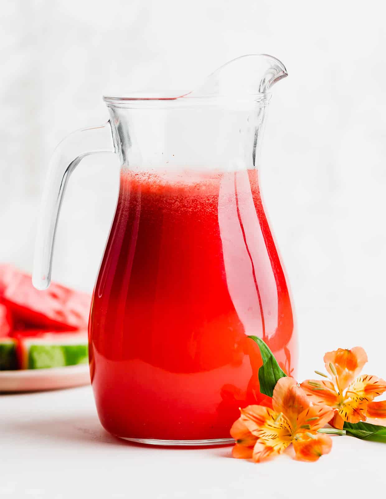 A glass pitcher full of Watermelon Lime Aqua Fresca.