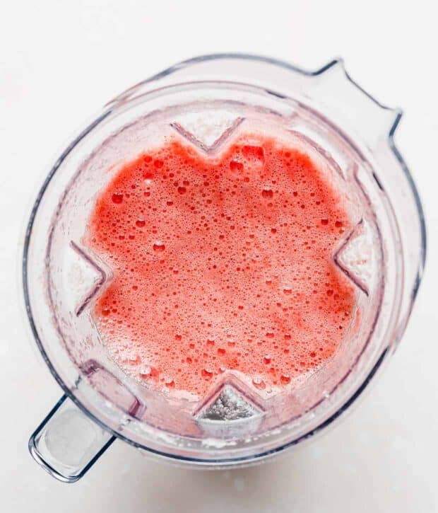 Overhead photo of pureed watermelon juice in a blender.