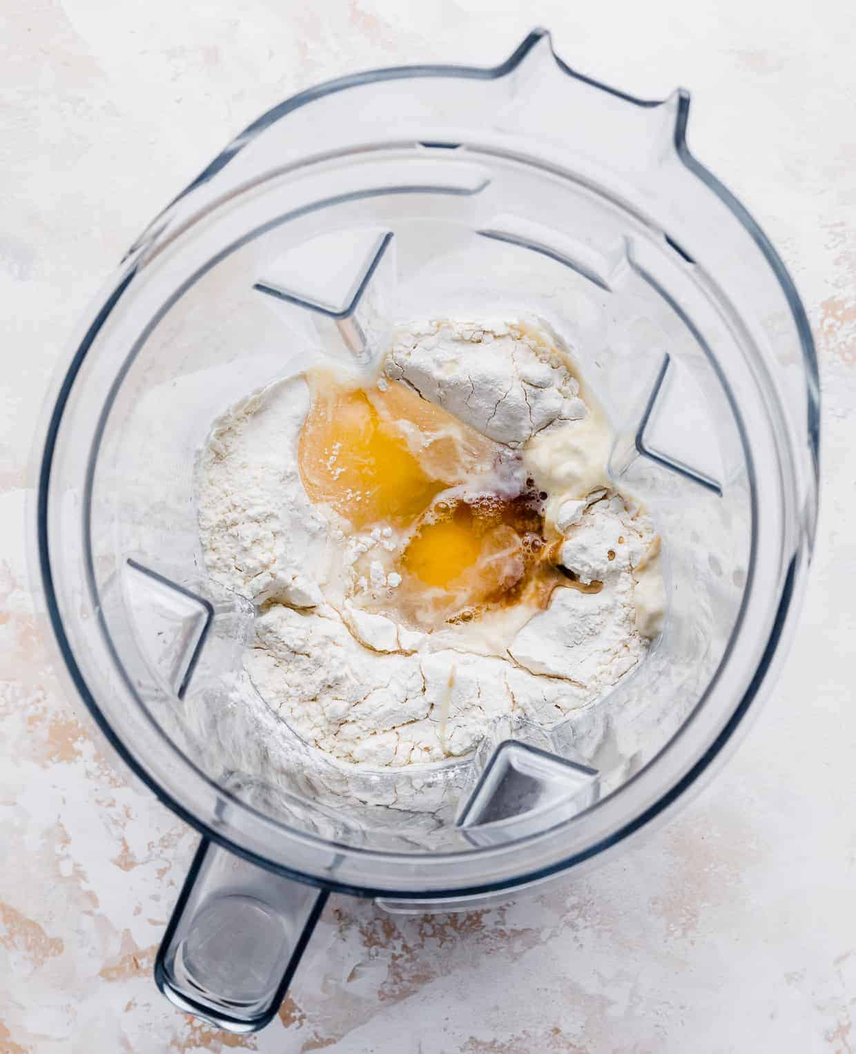 Eggs, flour, milk, and vanilla in a blender.
