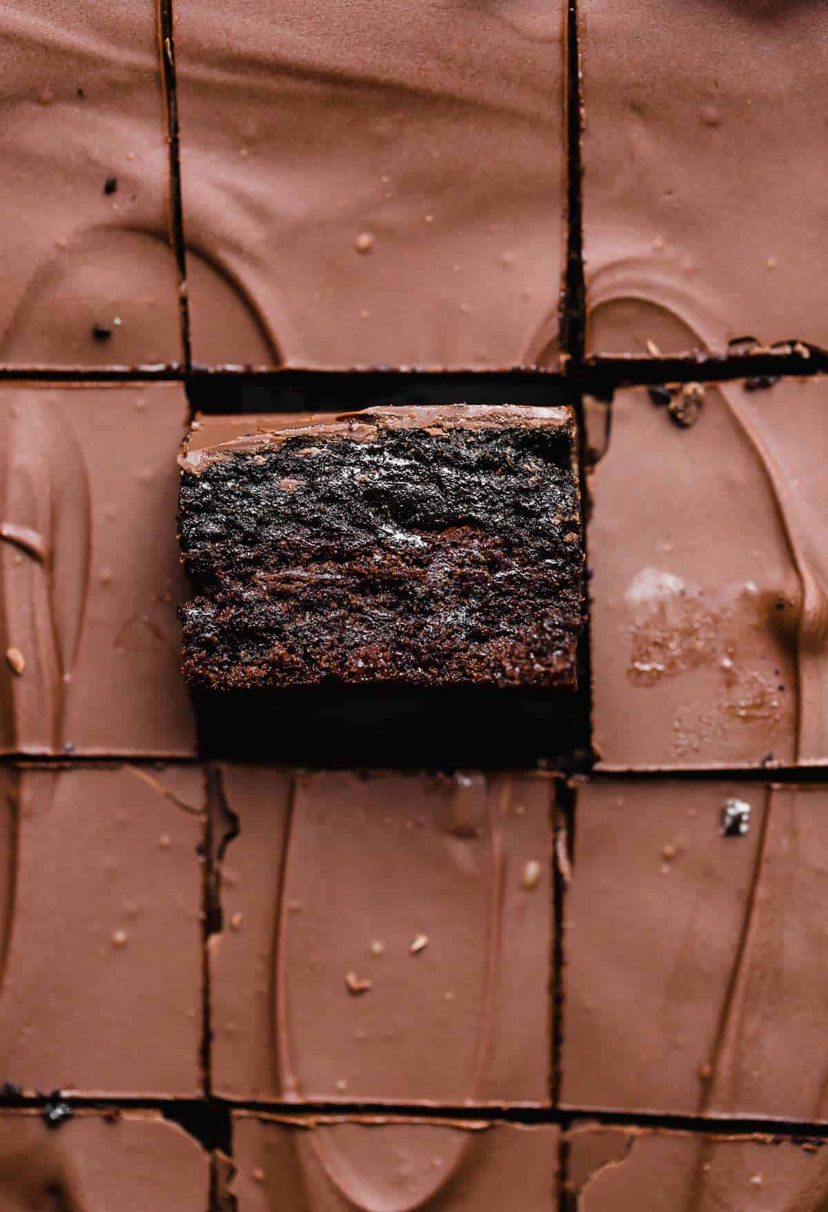 Oreo Truffle Brownies cut into squares, topped with a melted chocolate layer.