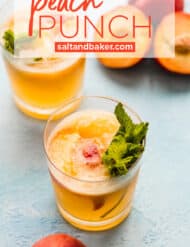 Two glasses of peach punch on a light blue background.