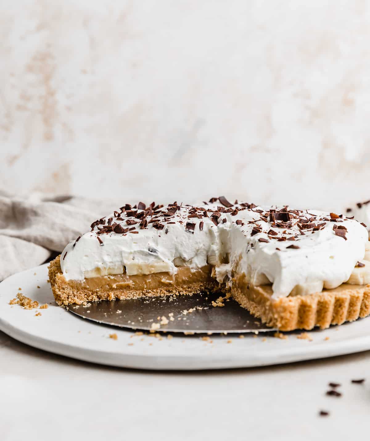 A Banoffee Pie on a white plate.