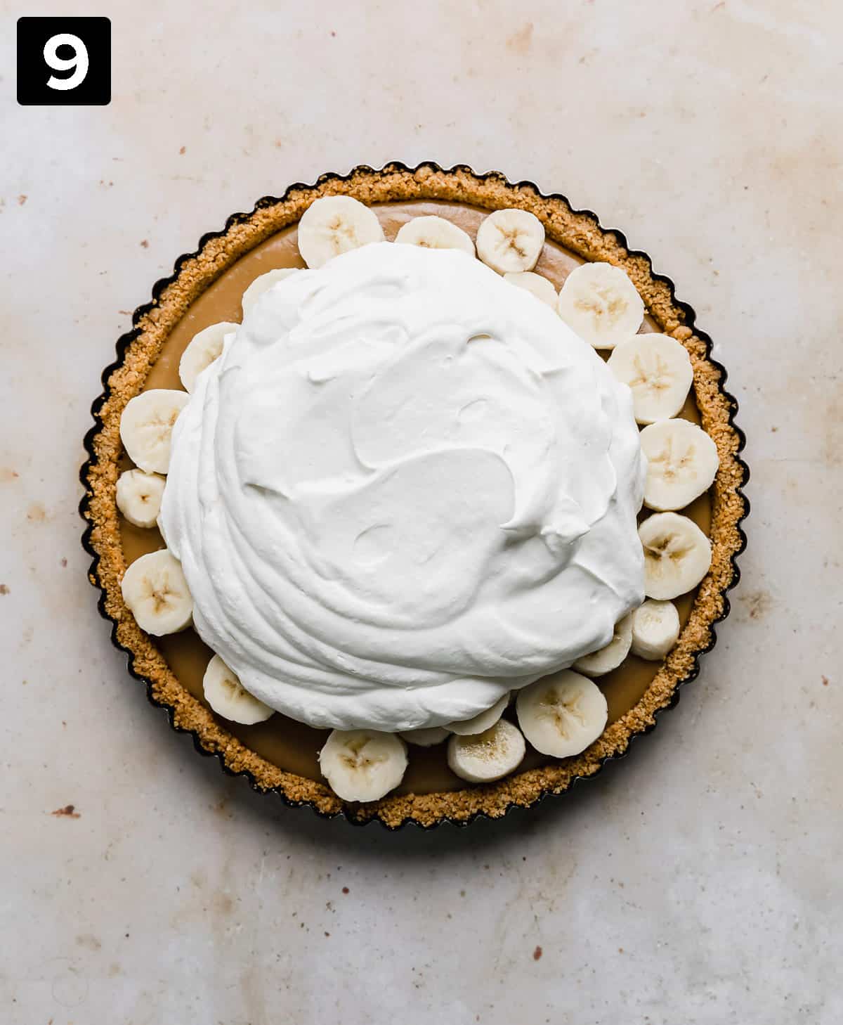 A Banoffee Pie topped with whipped cream.