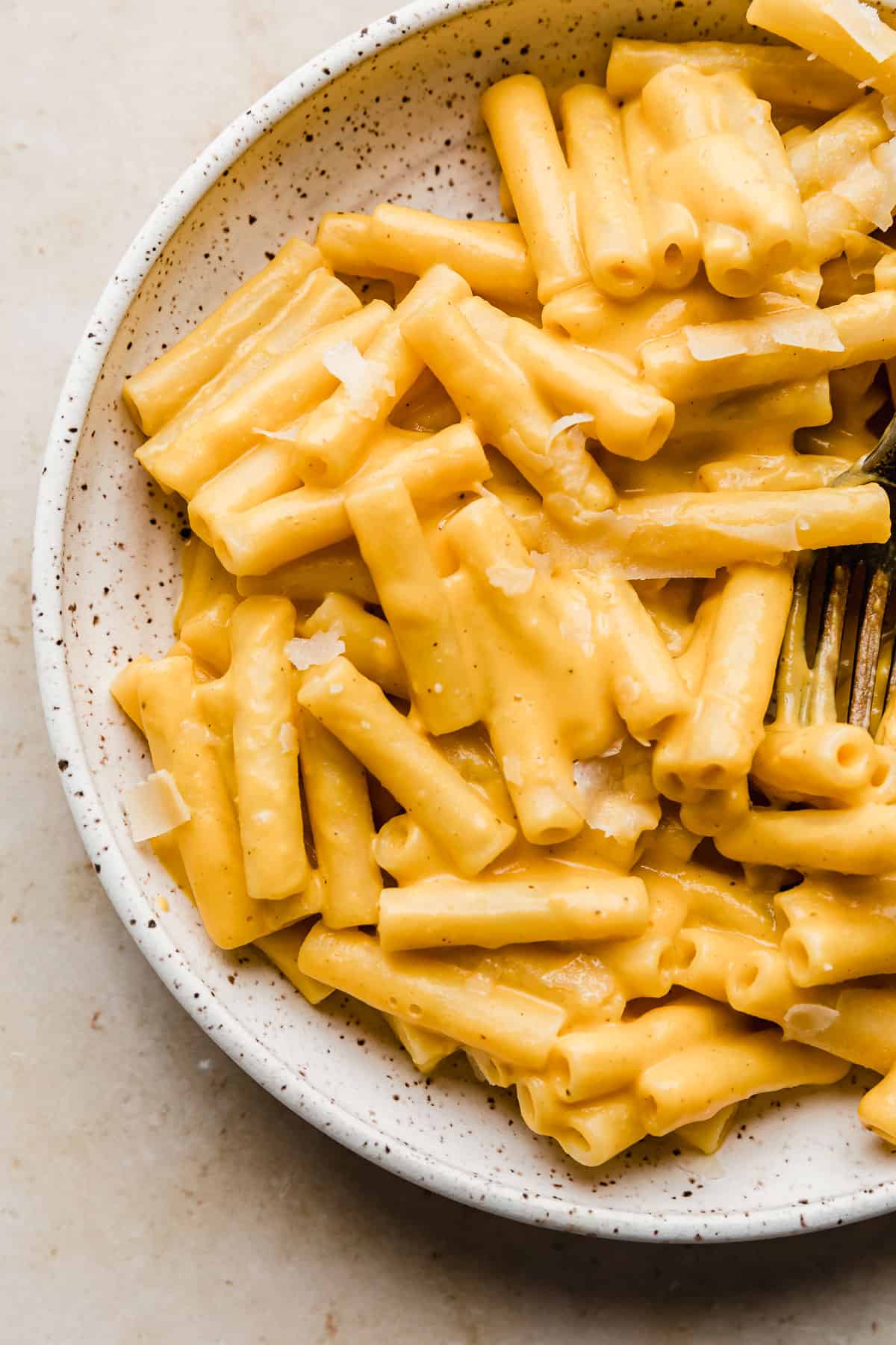 Creamy Roasted Butternut Squash Pasta sauce over ziti noodles in a white bowl.